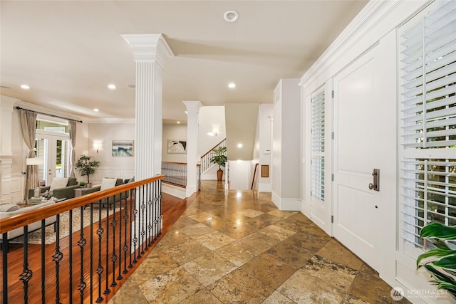 8380 SE 43rd St, Mercer Island, WA 98040 - corridor with ornate columns, stone tile flooring, recessed lighting, a wainscoted wall, and stairs