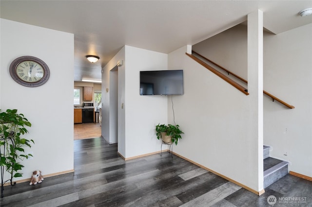 811 S Laventure Rd Unit C, Mount Vernon, WA 98274 - unfurnished living room featuring stairway, dark wood-type flooring, and baseboards