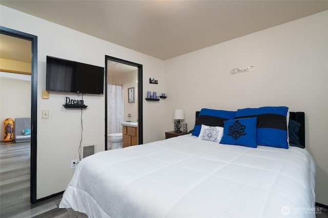 811 S Laventure Rd Unit C, Mount Vernon, WA 98274 - bedroom with wood finished floors and connected bathroom