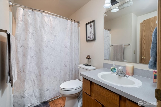 811 S Laventure Rd Unit C, Mount Vernon, WA 98274 - bathroom with vanity, toilet, wood finished floors, and a shower with shower curtain