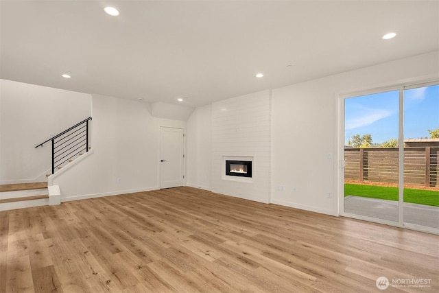 116 4th Ave S, Algona, WA 98001 - unfurnished living room with recessed lighting, light wood finished floors, stairway, baseboards, and a large fireplace