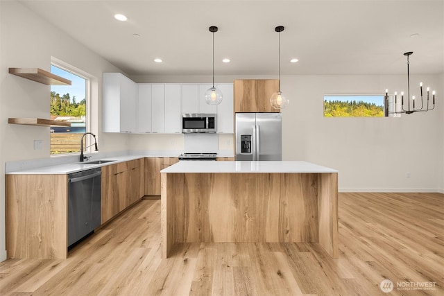 116 4th Ave S, Algona, WA 98001 - kitchen with appliances with stainless steel finishes, modern cabinets, a sink, a center island, and open shelves