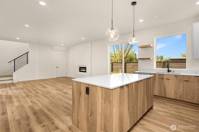 116 4th Ave S, Algona, WA 98001 - kitchen with a sink, light wood-type flooring, a kitchen island, modern cabinets, and recessed lighting