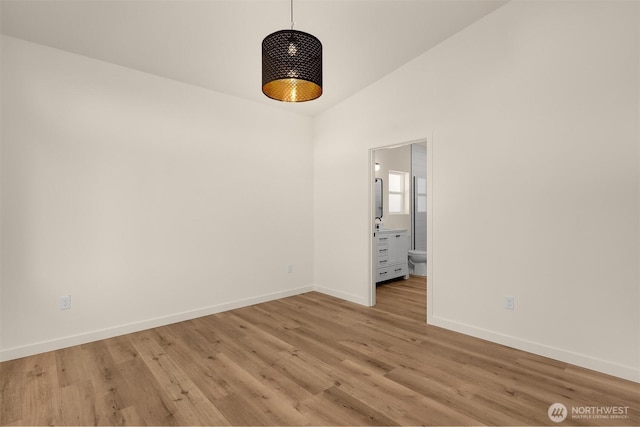 116 4th Ave S, Algona, WA 98001 - empty room featuring baseboards, light wood-type flooring, and a towering ceiling