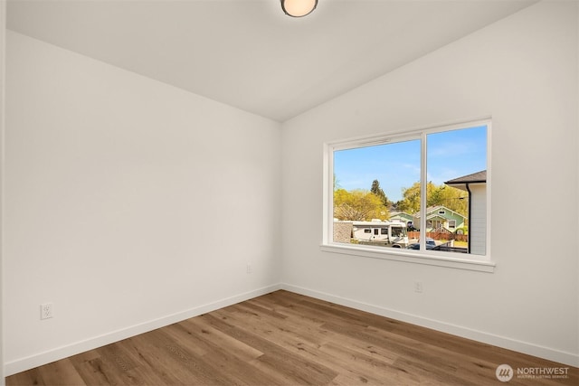 116 4th Ave S, Algona, WA 98001 - empty room featuring lofted ceiling, baseboards, and wood finished floors