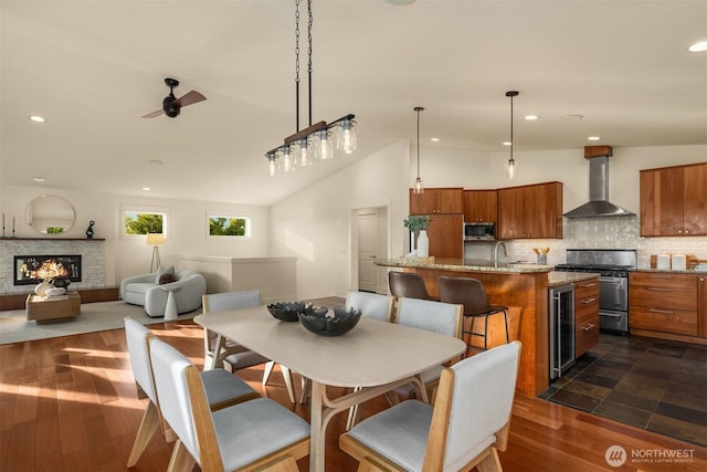 506 13th Ave W, Kirkland, WA 98033 - dining area featuring recessed lighting, a ceiling fan, wine cooler, a glass covered fireplace, and lofted ceiling