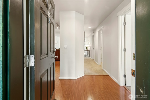 11309 NE 128th St Unit F302, Kirkland, WA 98034 - corridor featuring light wood-style flooring, baseboards, and recessed lighting