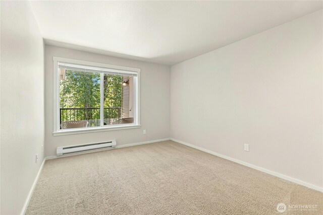 11309 NE 128th St Unit F302, Kirkland, WA 98034 - unfurnished room with baseboard heating, carpet, and baseboards