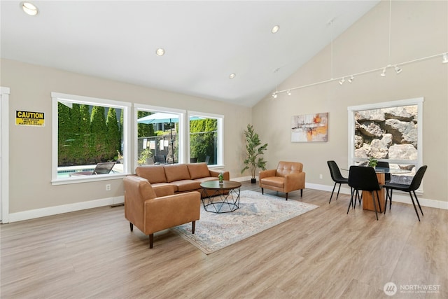 11309 NE 128th St Unit F302, Kirkland, WA 98034 - living room featuring light wood-type flooring, high vaulted ceiling, baseboards, and recessed lighting