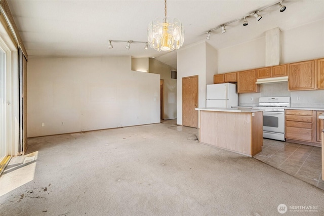9445 181st Way SW, Rochester, WA 98579 - kitchen featuring white appliances, track lighting, a kitchen island, light countertops, and a chandelier