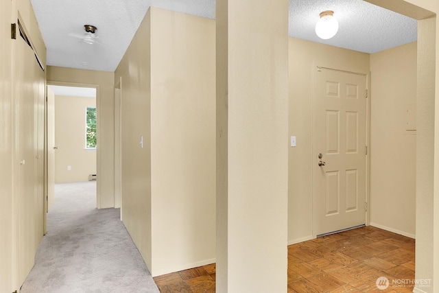 820 Cady Rd Unit H202, Everett, WA 98203 - hall featuring a textured ceiling and baseboards