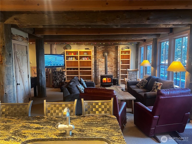 210 Gold Hill Rd, Enumclaw, WA 98022 - sitting room featuring a wood stove, carpet flooring, and beamed ceiling