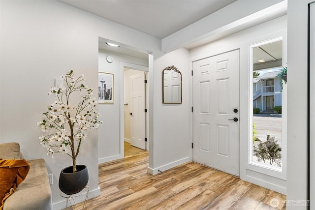 9106 1st Pl NE Unit 1, Lake Stevens, WA 98258 - entryway with light wood-style floors, baseboards, and healthy amount of natural light
