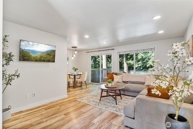 9106 1st Pl NE Unit 1, Lake Stevens, WA 98258 - living room with recessed lighting, light wood finished floors, and baseboards
