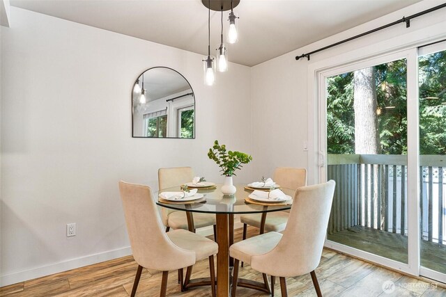 9106 1st Pl NE Unit 1, Lake Stevens, WA 98258 - dining room with baseboards and light wood-style floors