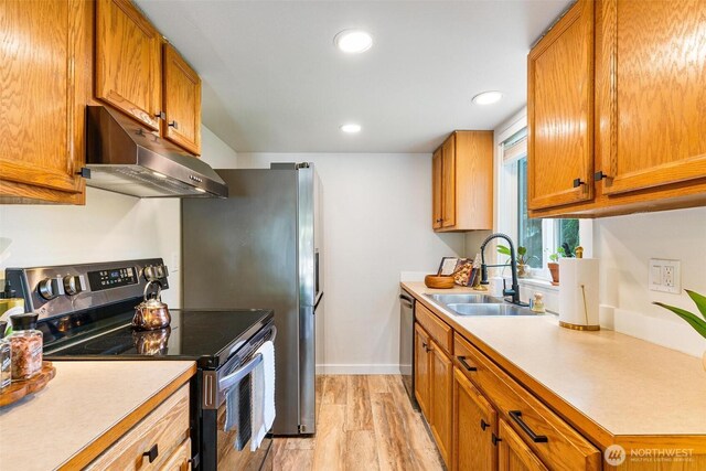 9106 1st Pl NE Unit 1, Lake Stevens, WA 98258 - kitchen with extractor fan, electric stove, a sink, light countertops, and recessed lighting