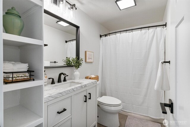 9106 1st Pl NE Unit 1, Lake Stevens, WA 98258 - bathroom with vanity, toilet, tile patterned flooring, and curtained shower