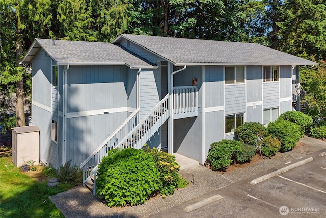 9106 1st Pl NE Unit 1, Lake Stevens, WA 98258 - view of property with stairway and uncovered parking