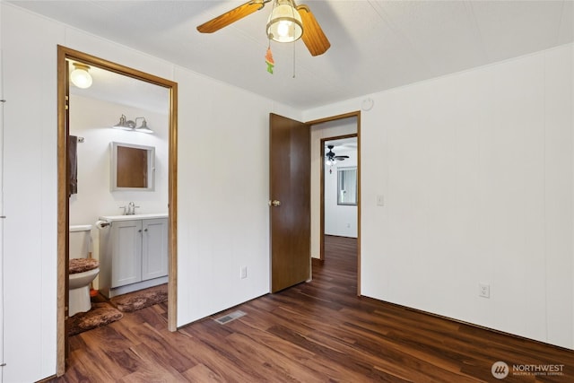 35605 158th St SE, Sultan, WA 98294 - unfurnished bedroom featuring dark wood-type flooring, a sink, ensuite bathroom, and a ceiling fan