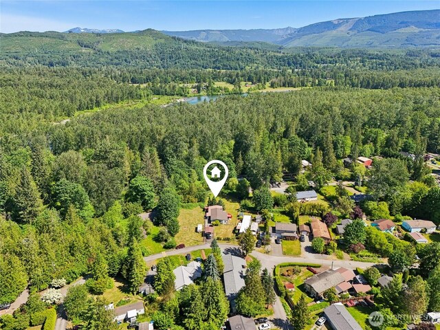 35605 158th St SE, Sultan, WA 98294 - aerial view of property's location featuring a heavily wooded area and a water and mountain view