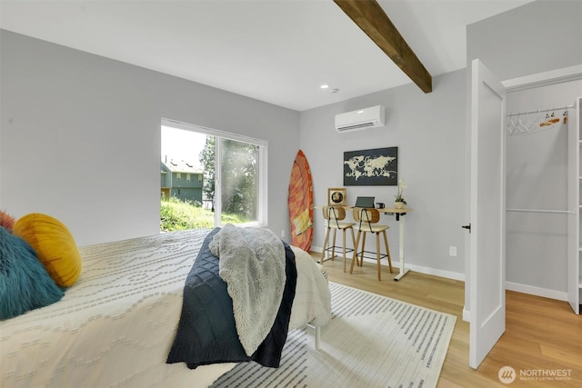 4902 Weber Rd, Snohomish, WA 98290 - bedroom featuring a wall unit AC, light wood-type flooring, beam ceiling, baseboards, and recessed lighting