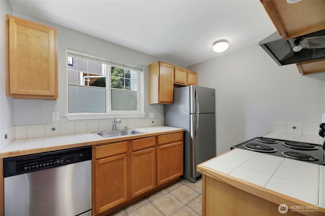 1132 N 198th St Unit C204, Shoreline, WA 98133 - kitchen featuring stainless steel appliances, tile counters, ventilation hood, and light tile patterned floors