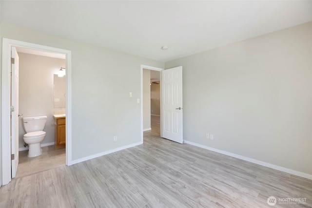 1132 N 198th St Unit C204, Shoreline, WA 98133 - unfurnished bedroom with light wood-style flooring and connected bathroom