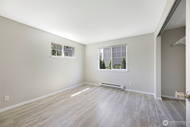 1132 N 198th St Unit C204, Shoreline, WA 98133 - spare room with baseboard heating and wood finished floors