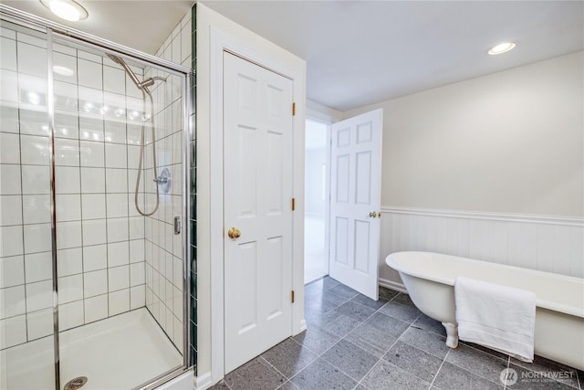 873 Olele Point Rd, Port Ludlow, WA 98365 - bathroom with a shower stall, a freestanding tub, wainscoting, and recessed lighting