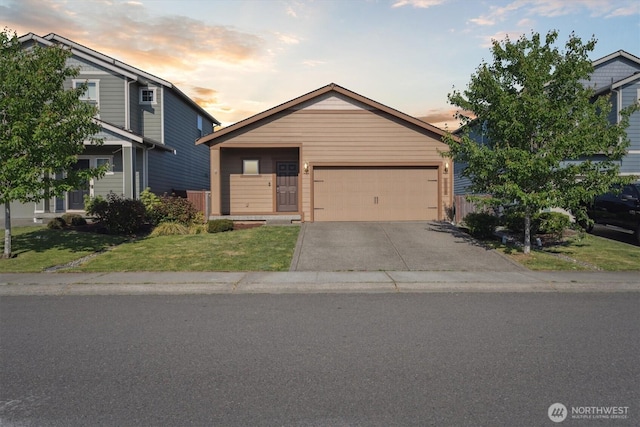 19218 18th Avenue Ct E, Spanaway, WA 98387 - view of front of home with concrete driveway, a front lawn, and an attached garage