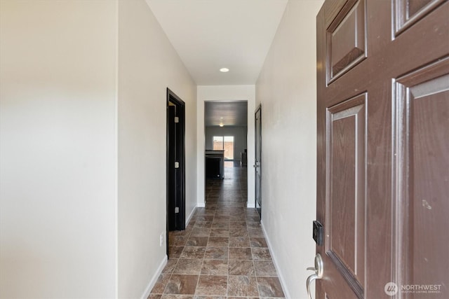 19218 18th Avenue Ct E, Spanaway, WA 98387 - hallway featuring baseboards and stone finish floors
