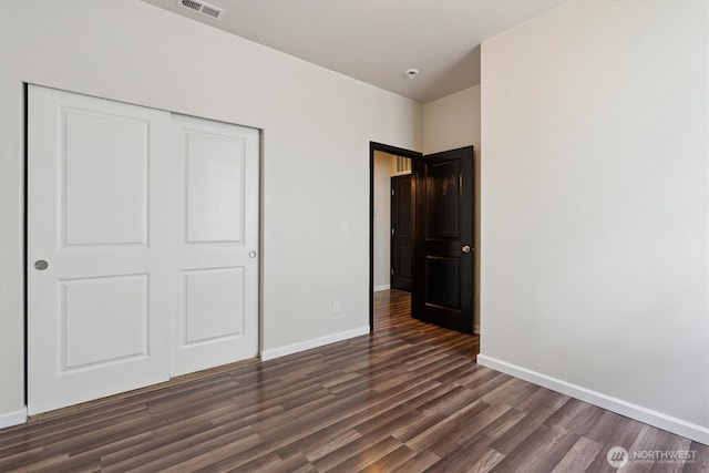 19218 18th Avenue Ct E, Spanaway, WA 98387 - unfurnished bedroom featuring dark wood-style flooring and a closet