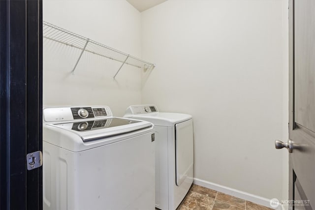 19218 18th Avenue Ct E, Spanaway, WA 98387 - washroom featuring baseboards and washing machine and clothes dryer