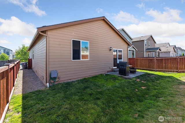 19218 18th Avenue Ct E, Spanaway, WA 98387 - back of house featuring a fenced backyard and a patio