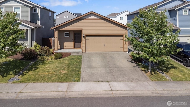 19218 18th Avenue Ct E, Spanaway, WA 98387 - view of front of property featuring an attached garage, concrete driveway, a front lawn, and a residential view
