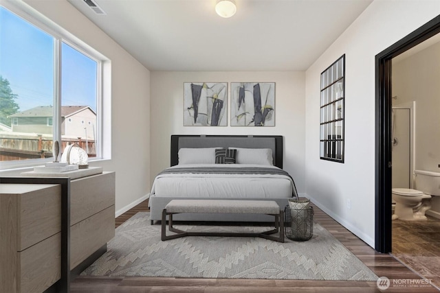 19218 18th Avenue Ct E, Spanaway, WA 98387 - bedroom featuring multiple windows, wood finished floors, and connected bathroom