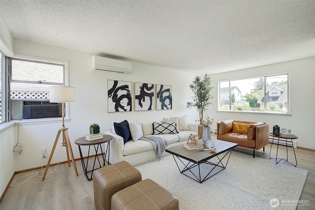 6424 32nd Ave S, Seattle, WA 98118 - living room with a wall mounted air conditioner, wood finished floors, a textured ceiling, and plenty of natural light