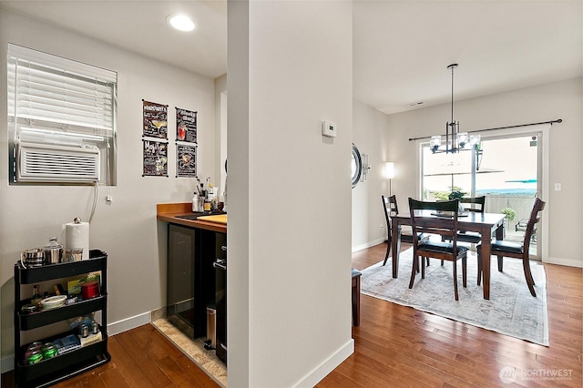 2237 55th St SE, Auburn, WA 98092 - dining space featuring bar, dark wood-style flooring, a chandelier, and recessed lighting