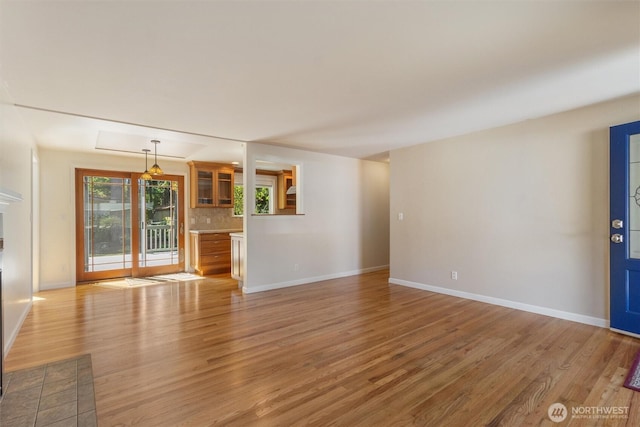 10502 240th Pl SW, Edmonds, WA 98020 - unfurnished living room with light wood-type flooring and baseboards