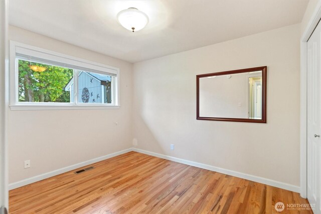 10502 240th Pl SW, Edmonds, WA 98020 - unfurnished room with baseboards and light wood-style flooring