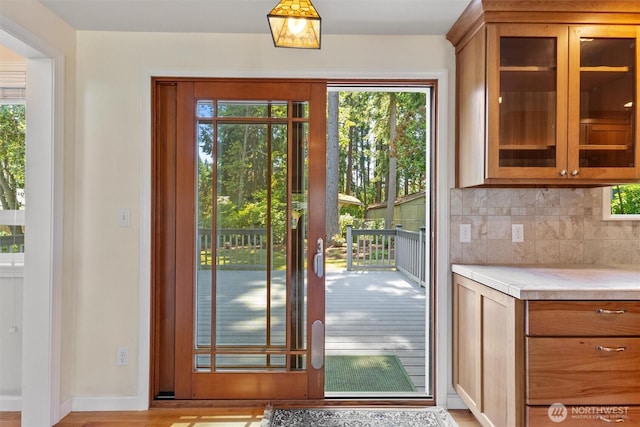 10502 240th Pl SW, Edmonds, WA 98020 - doorway with healthy amount of natural light, light wood-style floors, and baseboards