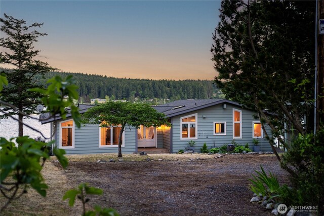 1794 Bayshore Rd, Lopez Island, WA 98261 - view of front facade featuring a view of trees