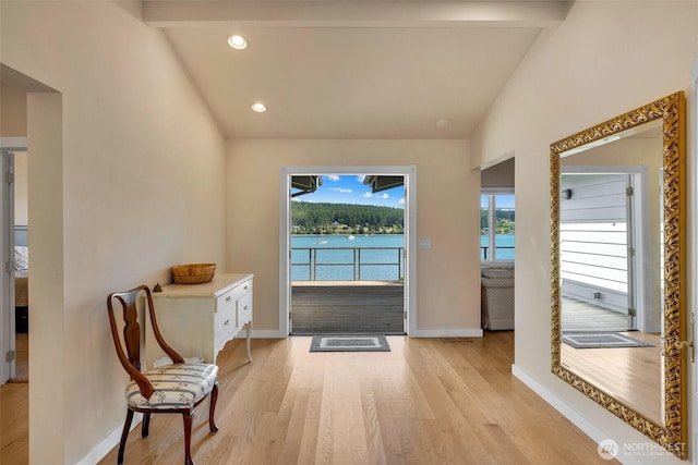 1794 Bayshore Rd, Lopez Island, WA 98261 - entryway featuring lofted ceiling, baseboards, light wood-style floors, a water view, and recessed lighting