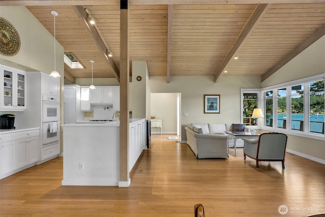 1794 Bayshore Rd, Lopez Island, WA 98261 - living room with wood ceiling, light wood-style floors, and baseboards