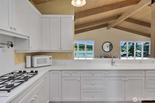 1794 Bayshore Rd, Lopez Island, WA 98261 - kitchen with white appliances, a sink, wood ceiling, white cabinets, and light countertops