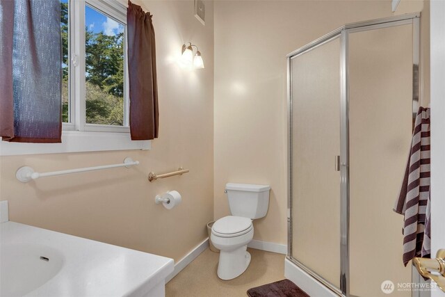 1794 Bayshore Rd, Lopez Island, WA 98261 - full bathroom with a stall shower, toilet, and baseboards