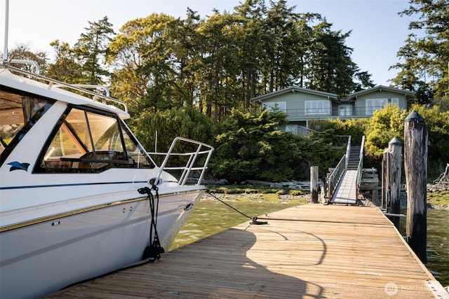 1794 Bayshore Rd, Lopez Island, WA 98261 - dock featuring stairs and view of wooded area
