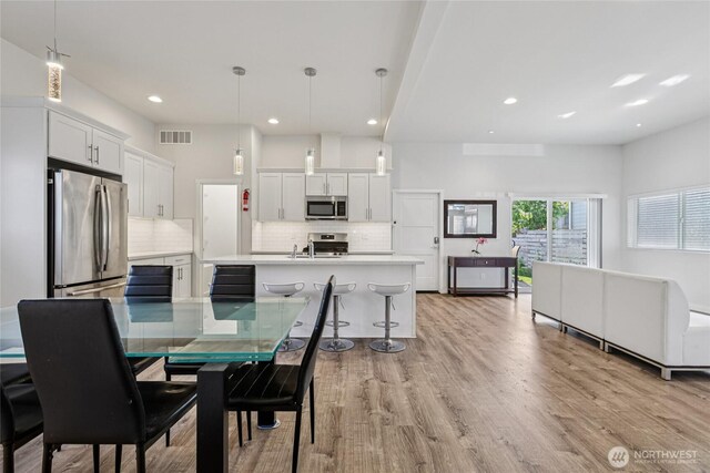 7724 16th Ave SW, Seattle, WA 98106 - dining space featuring recessed lighting and light wood-type flooring