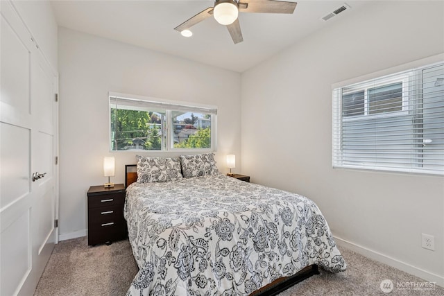 7724 16th Ave SW, Seattle, WA 98106 - carpeted bedroom featuring baseboards and a ceiling fan