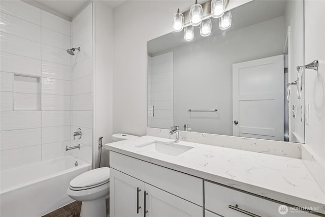 7724 16th Ave SW, Seattle, WA 98106 - bathroom featuring toilet, vanity, shower / bath combination, and wood finished floors